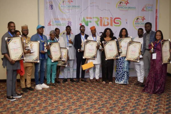 A group of recipients display their recognitions at the African Brands and Innovation event.