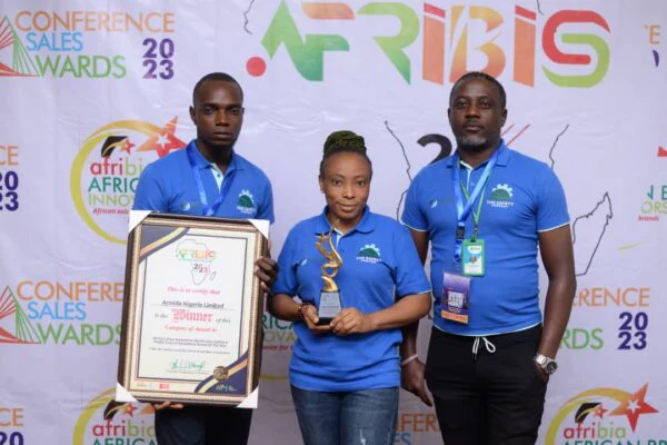 Representatives display Softcity Group’s African Brands and Innovation recognition and trophy.
