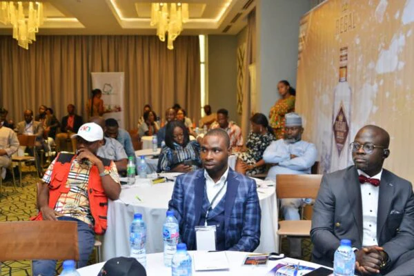 Dr. Stephen Adetutu Oniya and another attendee seated during the award event.