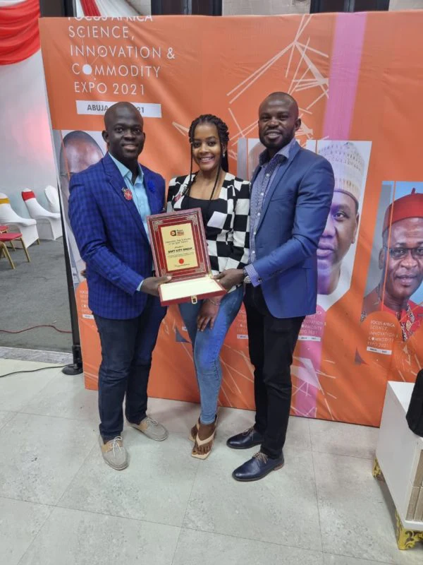 Softcity representatives hold the Focus Africa technology award.