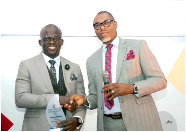 A Softcity representative receives the Best Technology Consulting Company of the Year award.