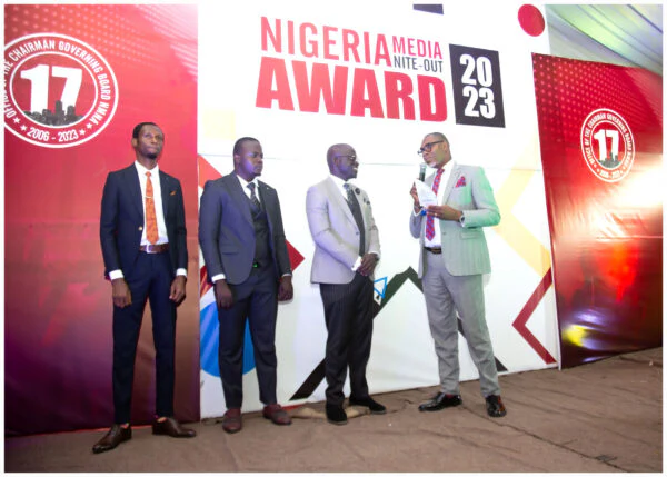 Award participants speaking on the Nigeria Media Merit Award stage.