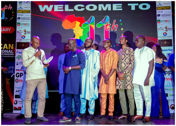 Softcity representatives and fellow participants on stage at the Pan African event.